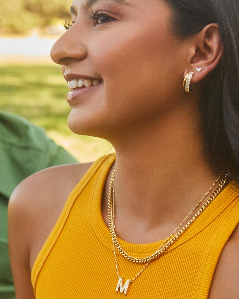 Livy Gold Huggie Earrings In White Crystal